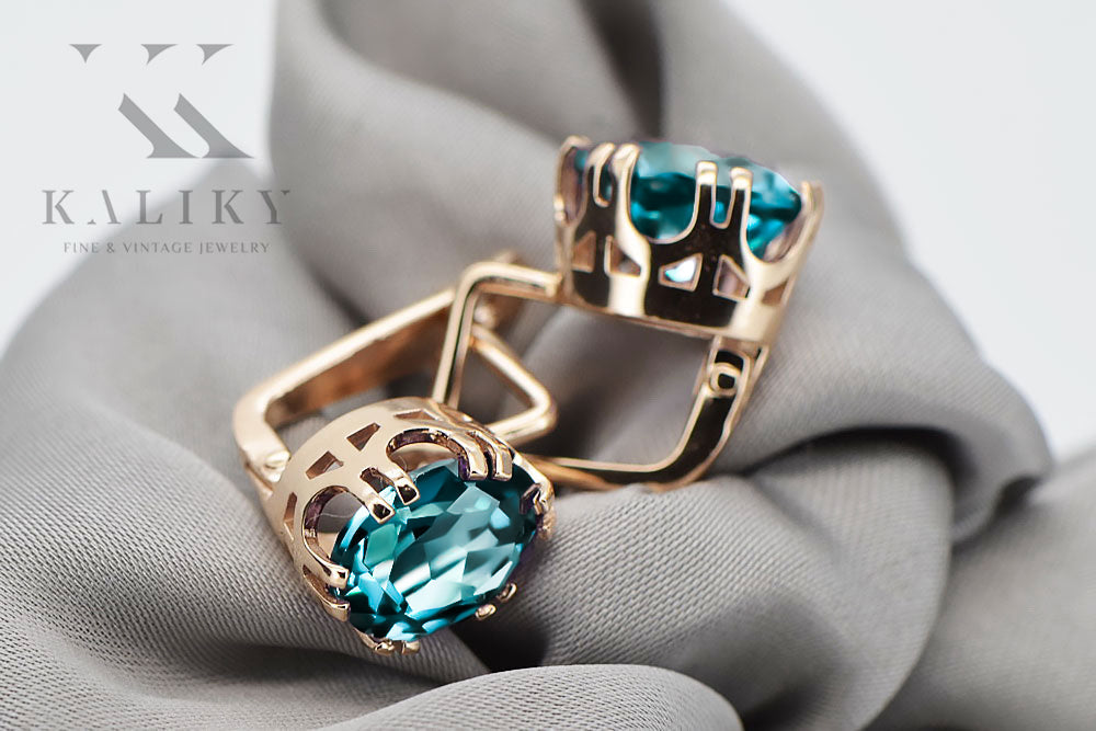 Vintage Aquamarine Earrings in 14K Rose Gold (vec016r-aq) — worn on the neckline, showing the drape
