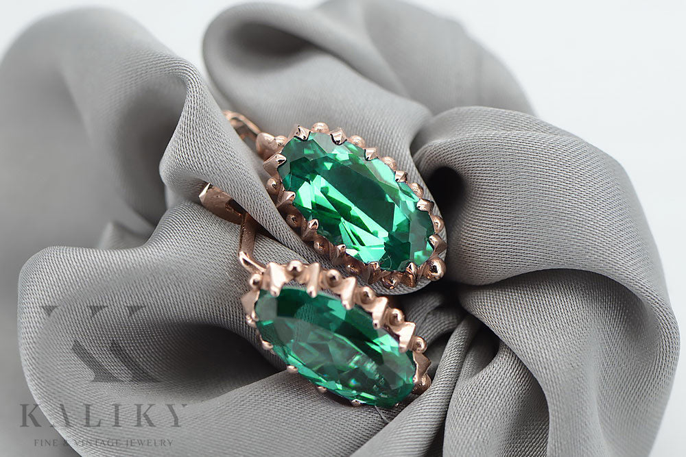 Vintage Emerald Earrings in 14K Rose Gold (vec174r-em) — worn on the neckline, showing the drape