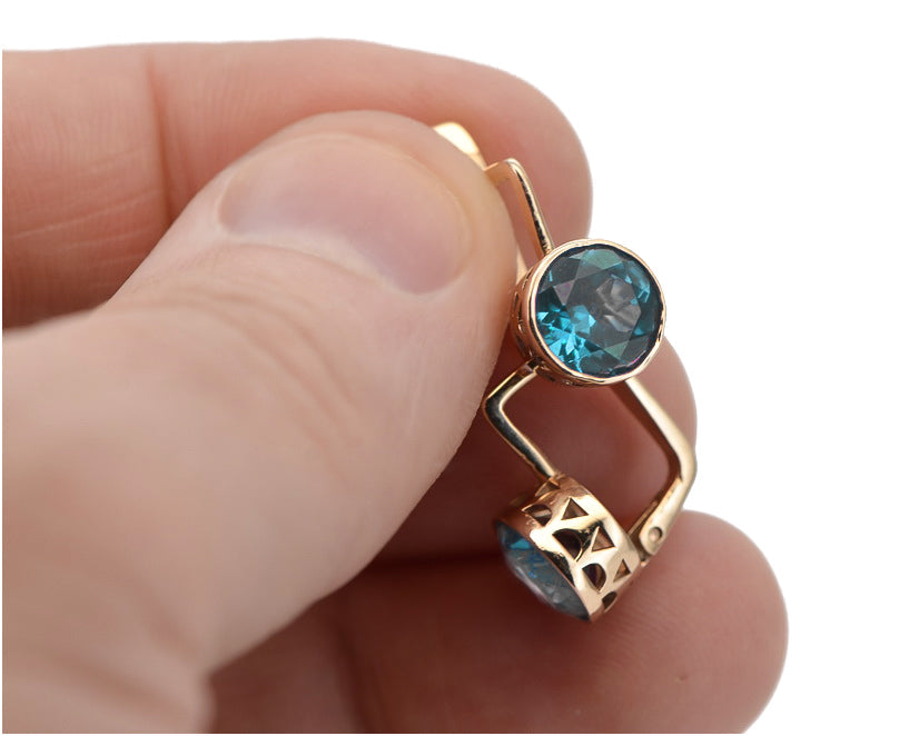 Vintage Aquamarine Earrings in 14K Rose Gold (vec107r-aq) — worn on the hand, showing profile