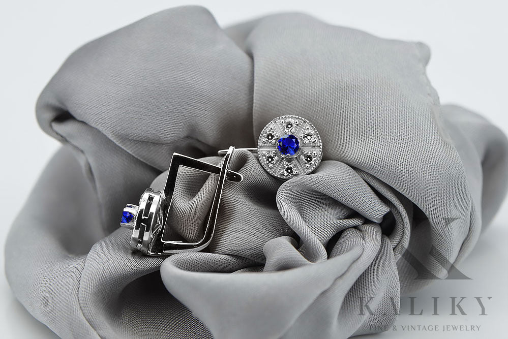 Vintage Sapphire Earrings in 14K White Gold (vec161w-sp) — worn on the neckline, showing the drape