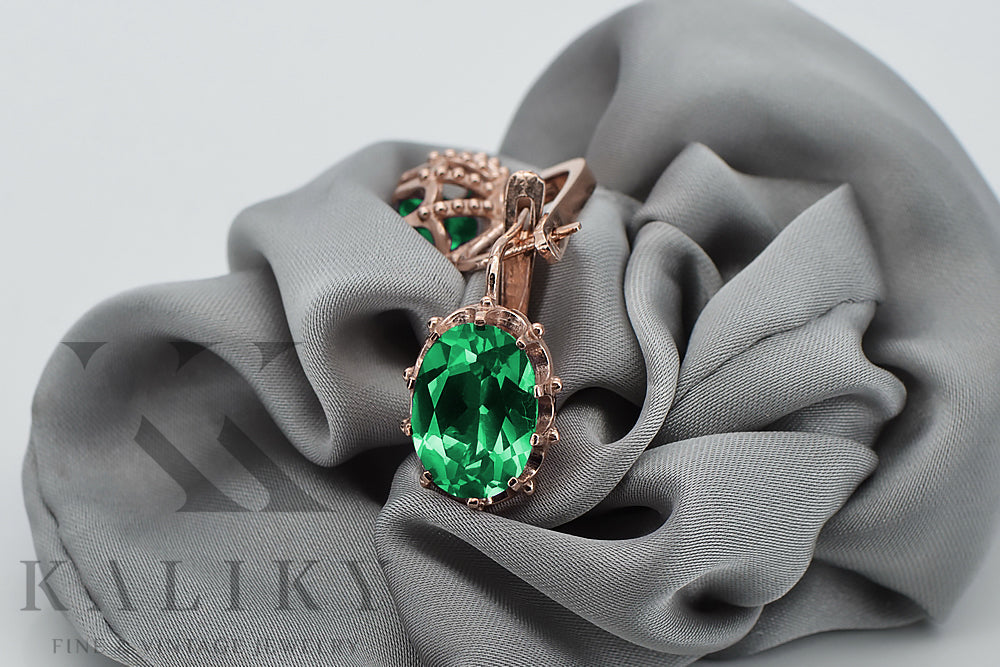 Vintage Emerald Earrings in 14K Rose Gold (vec079r-em) — worn on the neckline, showing the drape