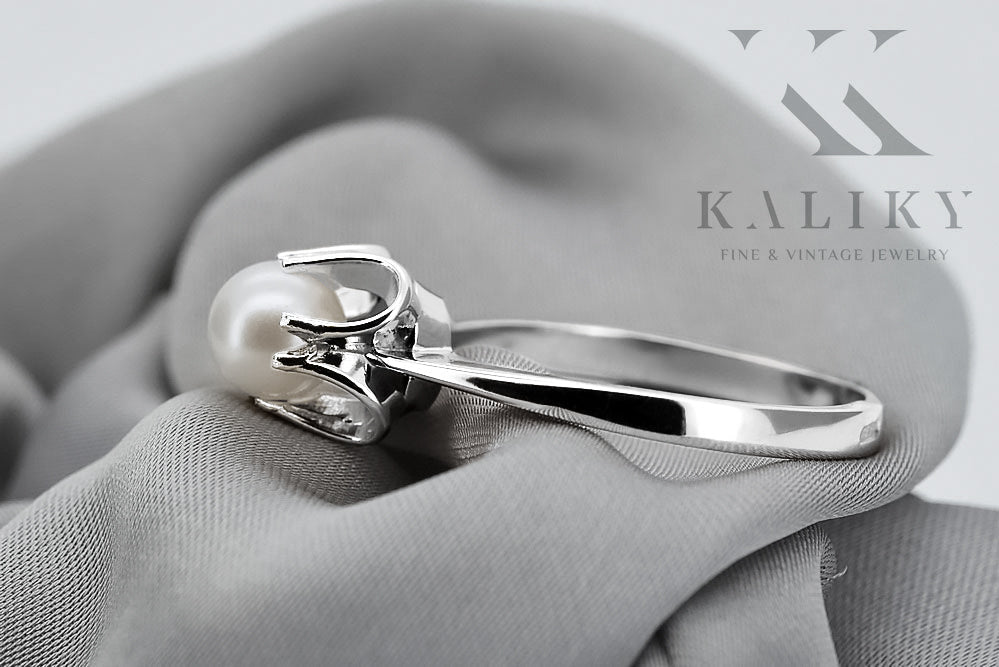 Vintage Pearl Ring in Sterling Silver (vrpr001s) — worn on the neckline, showing the drape