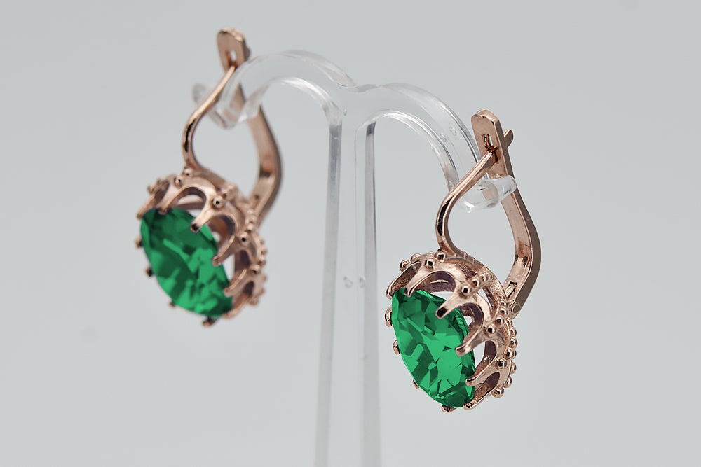Vintage Emerald Earrings in 14K Rose Gold (vec079r-em) — worn on the hand, showing profile