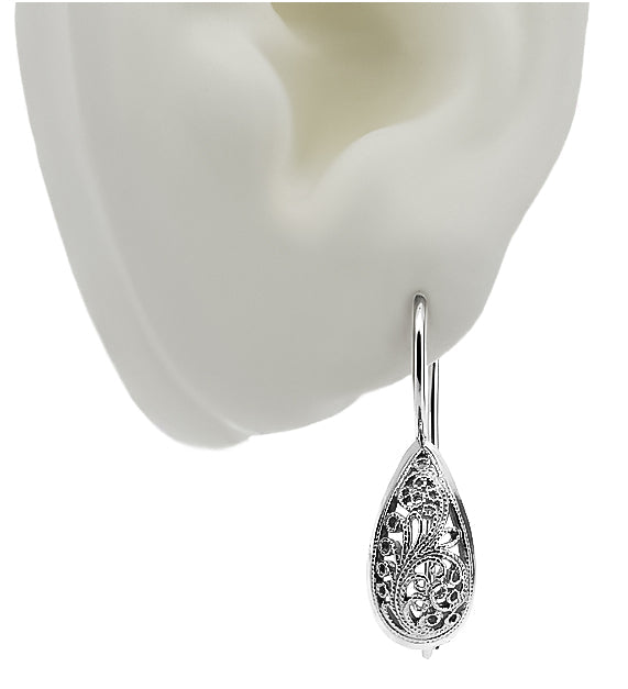 Vintage Earrings in Sterling Silver (ven023s) — worn on the hand, showing profile