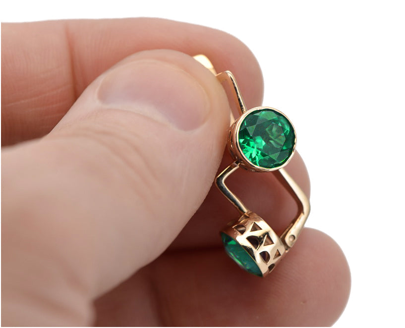 Vintage Emerald Earrings in 14K Rose Gold (vec107r-em) — worn on the neckline, showing the drape
