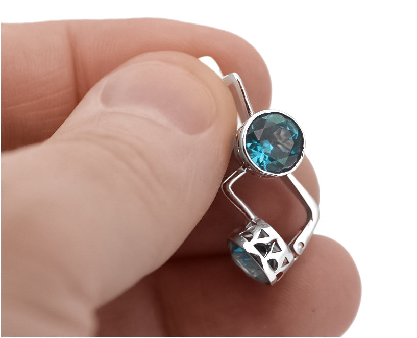 Vintage Aquamarine Earrings in Sterling Silver (vec107s-aq) — worn on the hand, showing profile