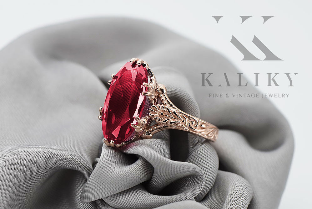 Vintage Ruby Ring in 14K Rose Gold (vrc084r-rb) — worn on the neckline, showing the drape