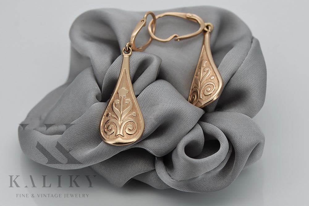 Vintage Leaf Earrings in 14K Rose Gold (ven147) — worn on the neckline, showing the drape