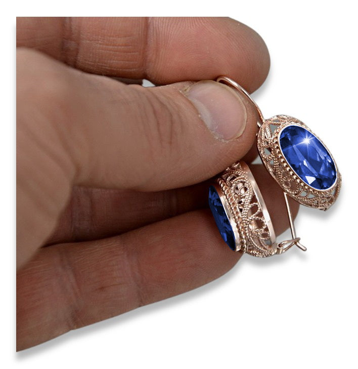 Vintage Sapphire Oval Cut Earrings in 14K Rose Gold (vec023r-sp) — worn on the hand, showing profile
