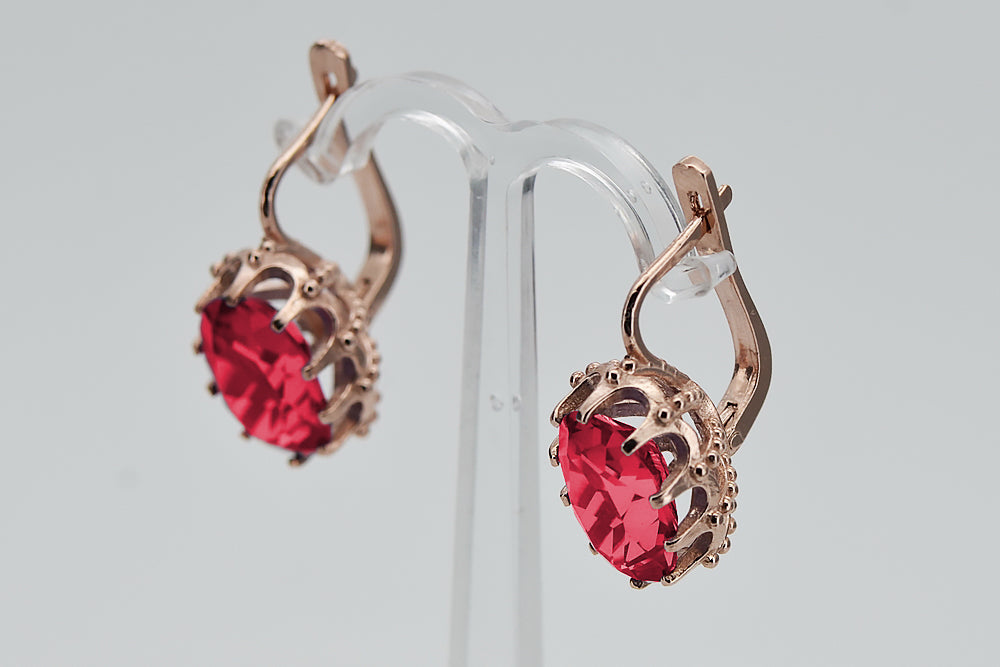 Vintage Ruby Lady Earrings in 14K Rose Gold (vec079r-rb) — worn on the hand, showing profile