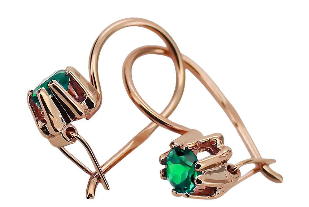 Vintage Emerald Craft Earrings in 14K Rose Gold (vec053r-em) — worn on the hand, showing profile