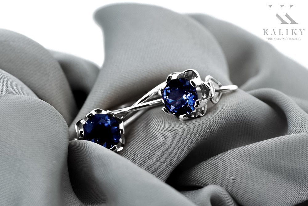 Vintage Sapphire Earrings in Sterling Silver (vec019s-sp) — worn on the hand, showing profile
