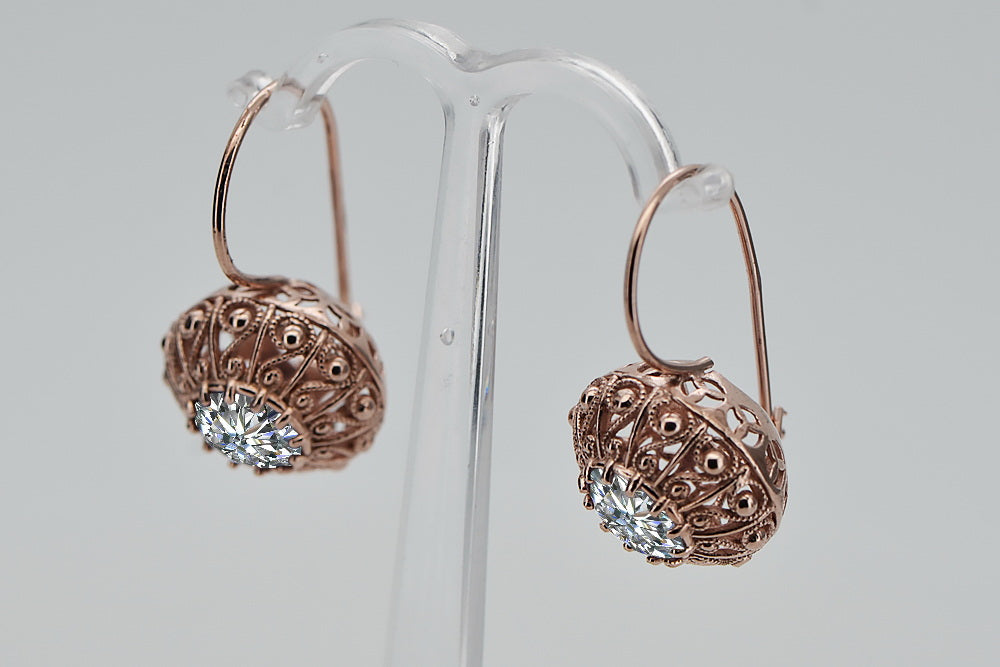 Vintage Zircon Zorcon Earrings in 14K Rose Gold (vec002r-zi) — worn on the hand, showing profile