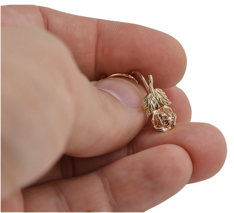 Vintage Flower Earrings in 14K Rose Gold (ven010r) — worn on the hand, showing profile