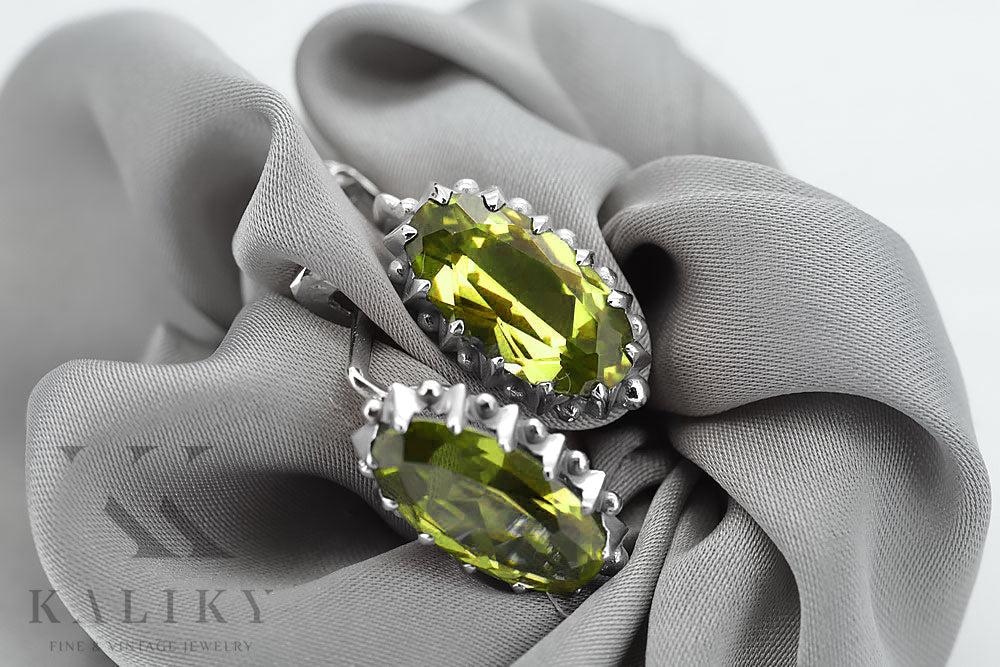 Vintage Yellow Peridot Earrings in Sterling Silver (vec174s-yp) — worn on the hand, showing profile
