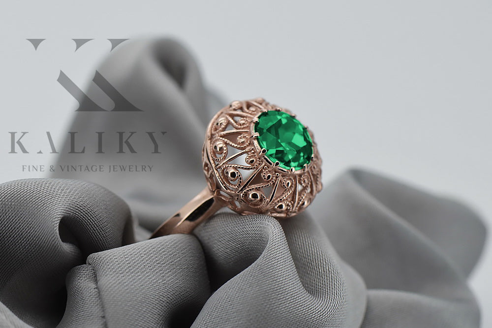Vintage Emerald Round Womens Ring in 14K Rose Gold (vrc059r-em) — worn on the neckline, showing the drape