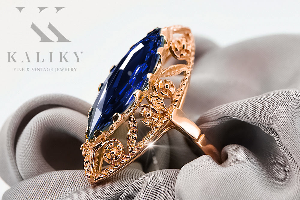 Vintage Sapphire Ring in 14K Rose Gold (vrc005r-sp) — worn on the neckline, showing the drape