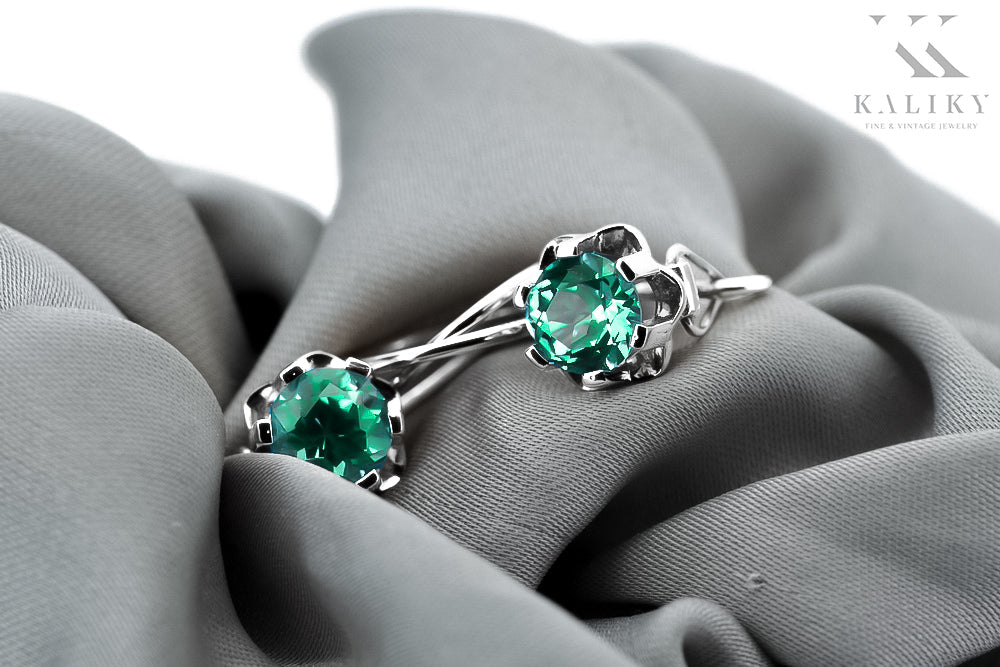 Vintage Emerald Earrings in Sterling Silver (vec019s-em) — worn on the hand, showing profile