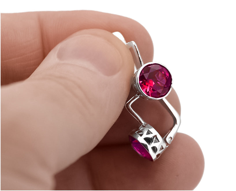 Vintage Ruby Earrings in Sterling Silver (vec107s-rb) — worn on the hand, showing profile