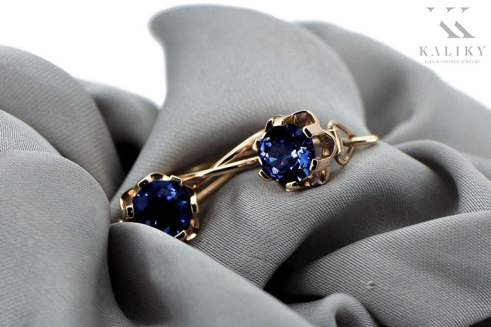Vintage Sapphire Earrings in 14K Rose Gold (vec019r-sp) — worn on the neckline, showing the drape
