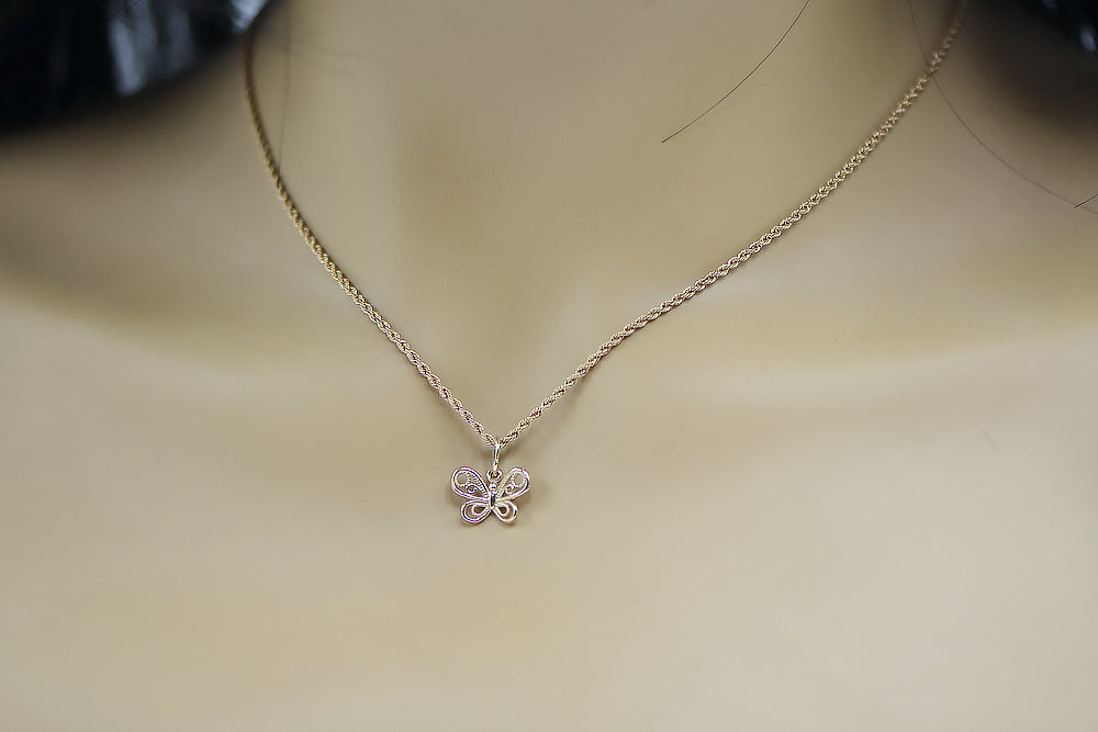 Vintage Butterfly Pendant in 14K Rose Gold (vpn062) — worn on the hand, showing profile