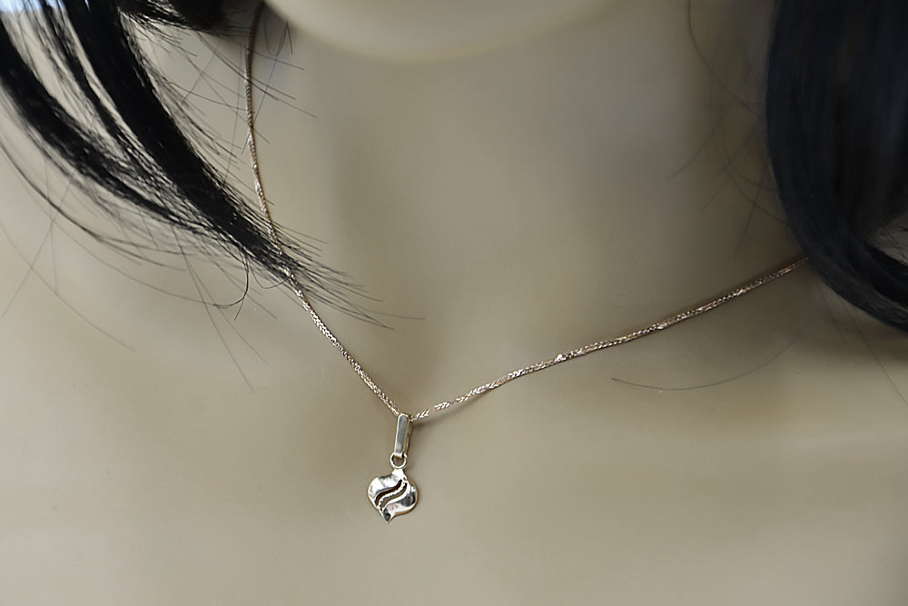 Vintage Leaf Pendant in 14K Rose Gold (vpn005) — worn on the neckline, showing the drape
