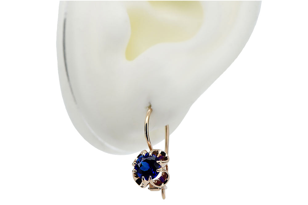 Vintage Sapphire Earrings in 14K Rose Gold (vec035r-sp) — worn on the neckline, showing the drape