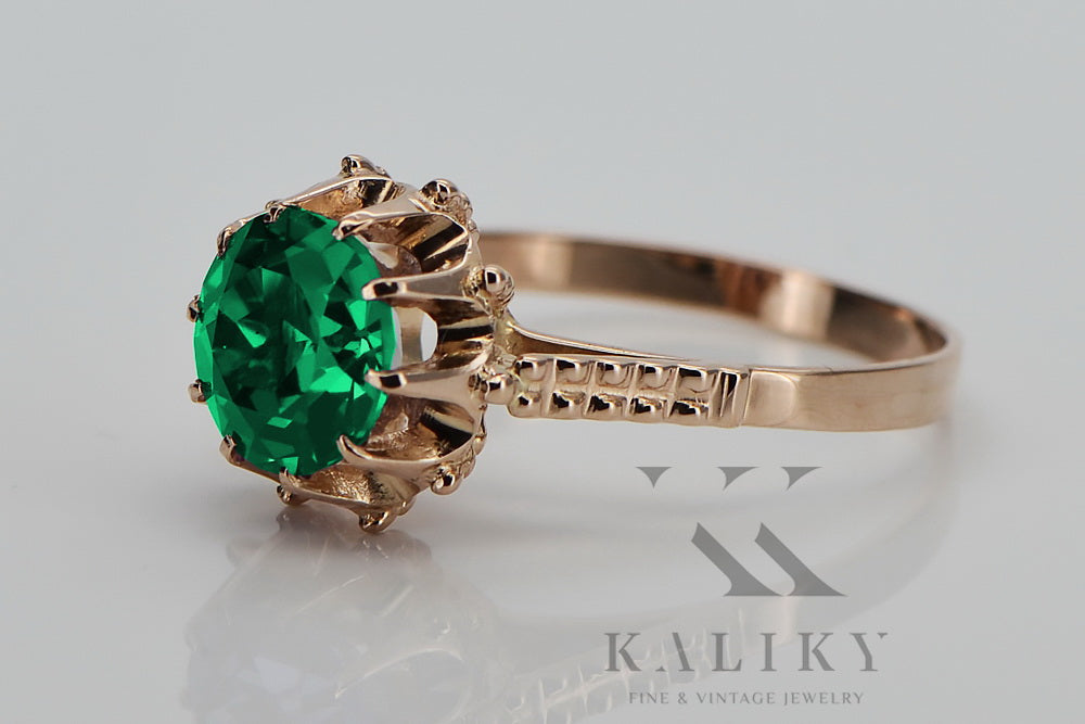 Vintage Emerald Ring in 14K Rose Gold (vrc045r-em) — worn on the neckline, showing the drape