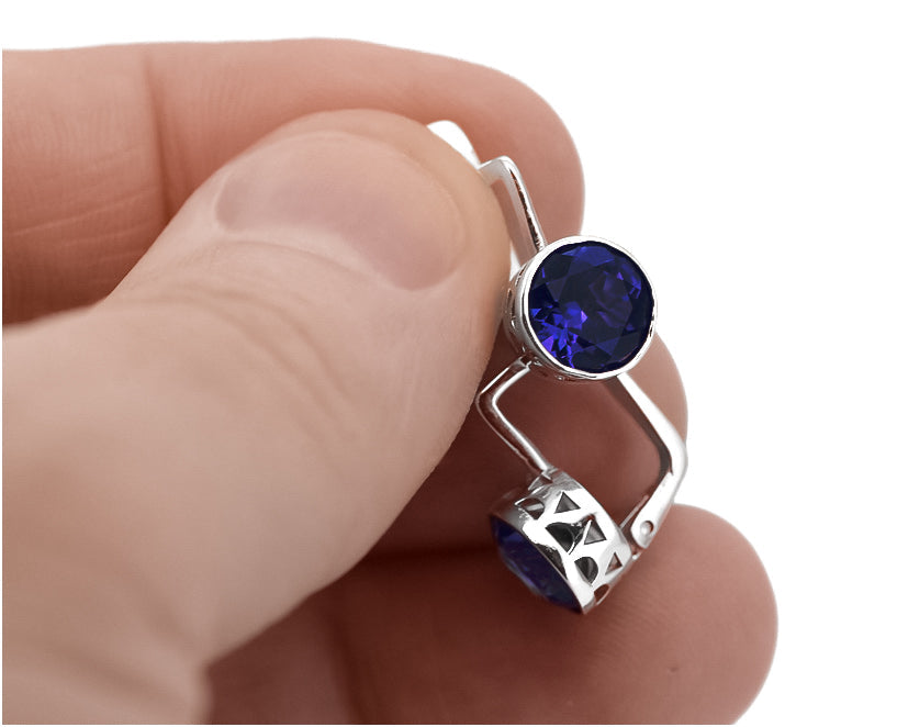 Vintage Sapphire Earrings in Sterling Silver (vec107s-sp) — worn on the hand, showing profile