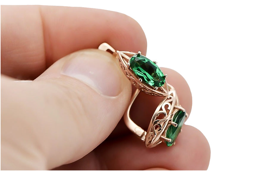 Vintage Emerald Oval Earrings in 14K Rose Gold (vec141r-em) — worn on the hand, showing profile