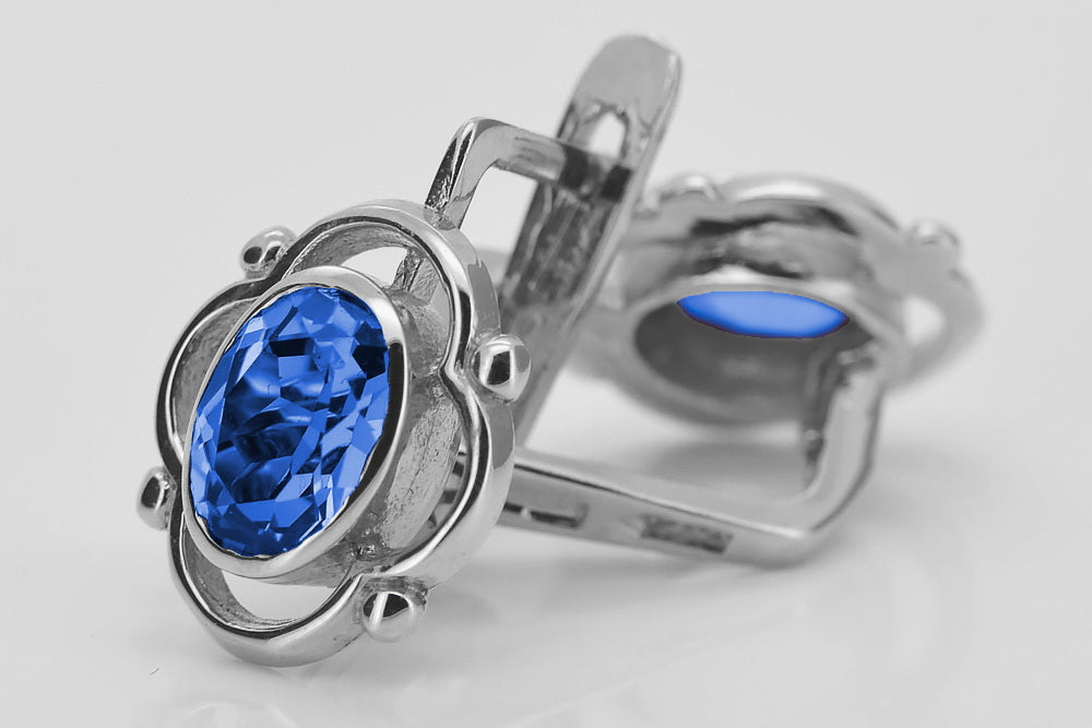 Vintage Sapphire Earrings in Sterling Silver (vec033s-sp) — worn on the neckline, showing the drape