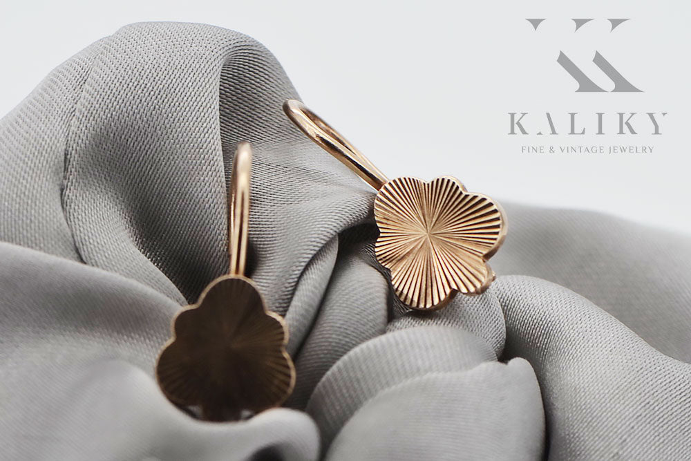 Vintage Leaf Earrings in 14K Rose Gold (ven165) — worn on the neckline, showing the drape