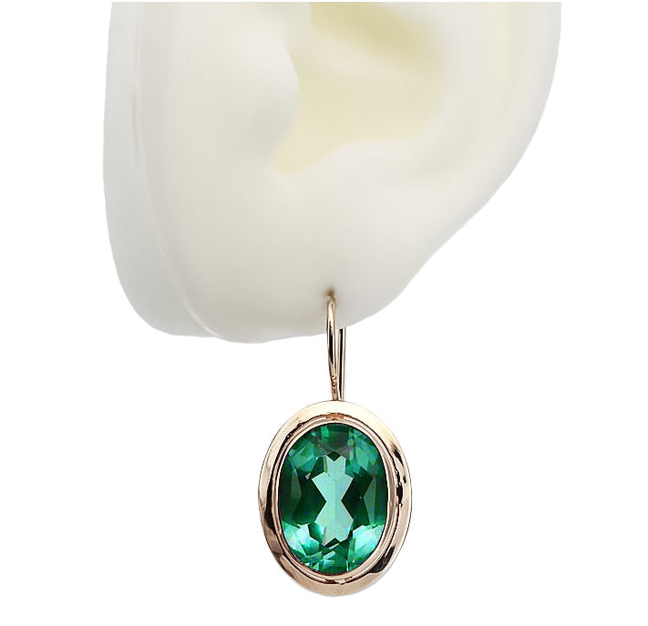 Vintage Emerald Earrings in 14K Rose Gold (vec114r-em) — worn on the hand, showing profile