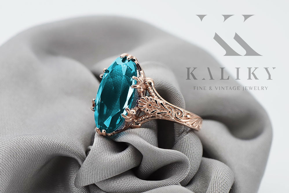 Vintage Aquamarine Akwamatyn Ring in 14K Rose Gold (vrc084r-aq) — worn on the neckline, showing the drape