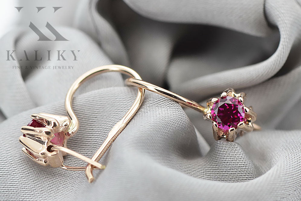 Vintage Ruby Earrings in 14K Rose Gold (vec053r-rb) — worn on the neckline, showing the drape