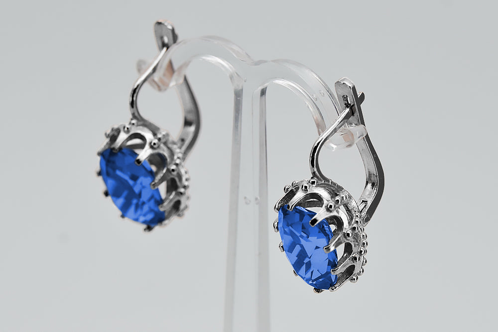 Vintage Sapphire Earrings in Sterling Silver (vec079s-sp) — worn on the neckline, showing the drape