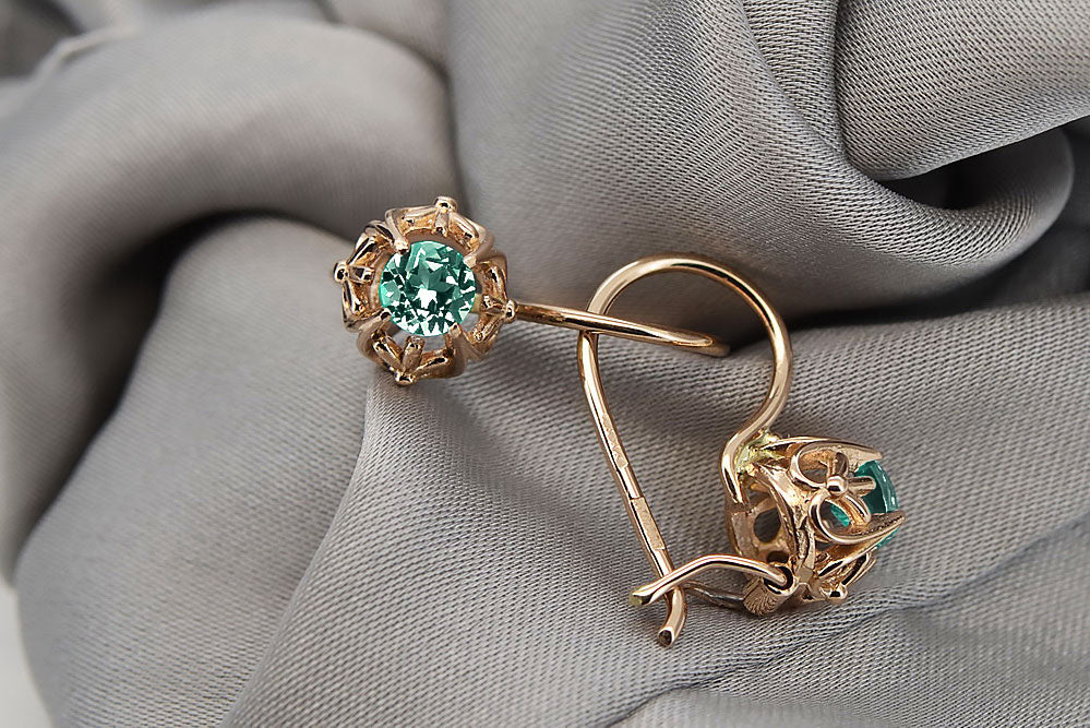 Vintage Emerald Made Earrings in 14K Rose Gold (vec145r-em) — worn on the hand, showing profile
