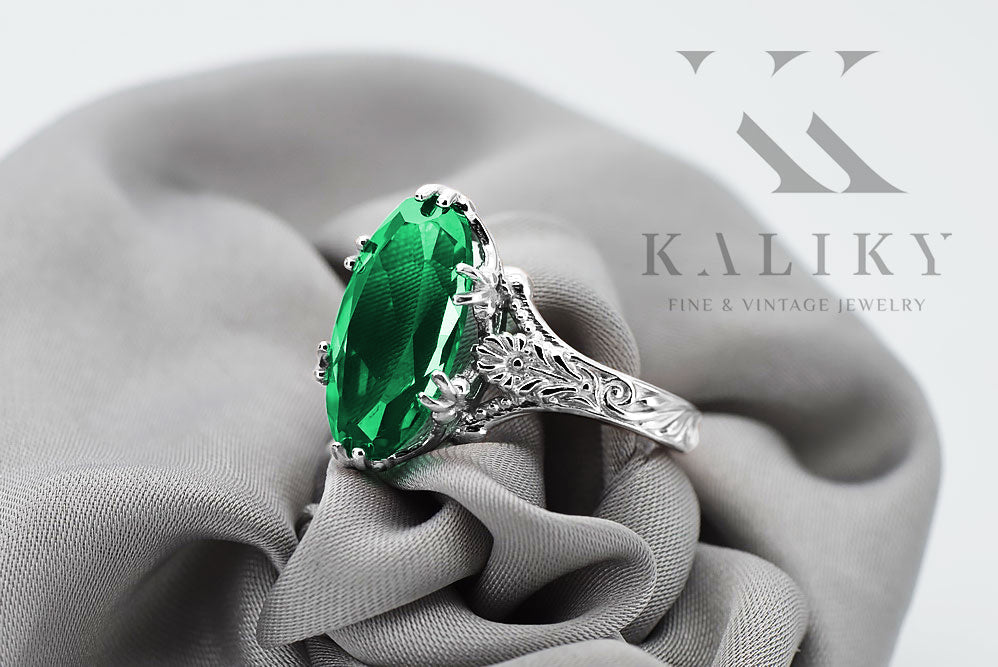 Vintage Emerald Oval Polish Ring in Sterling Silver (vrc084s-em) — worn on the neckline, showing the drape