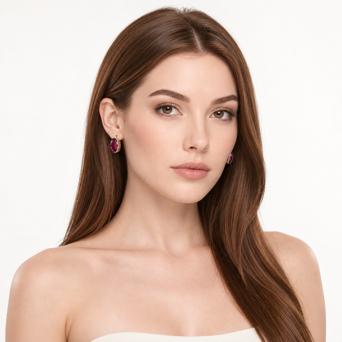 Oval ruby earrings in 14K rose gold worn by model, full head and neckline